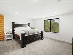 Upstairs Master Bedroom featuring log walls and light carpet, Mountain Views and large walk in closet.