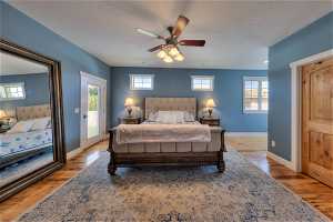 Bedroom featuring light hardwood flooring and ceiling fan