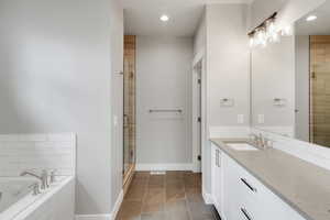 Master bathroom with large bathtub and shower