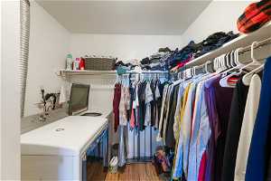 Walk in closet with independent washer and dryer