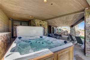 Hot tub on lower patio is covered so you don't have to shovel snow, but can still see stars.