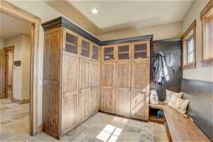 Huge mud room with cabinets as you enter from the garage