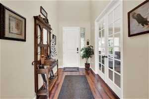 Foyer entrance with hardwood floors and french doors