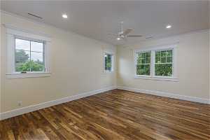 Unfurnished room with hardwood floors, ornamental molding, and ceiling fan