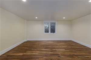 View of wood floored spare room