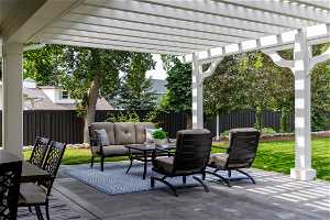 View of terrace featuring an outdoor living space and a pergola
