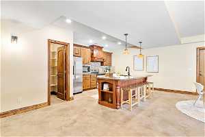 Full basement kitchen with a walk-in pantry and separate entrance to the outside driveway