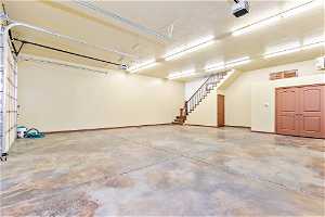 Detached garage. Storage under the stairs, tanning bed in the closet, 9'9" tall ceilings.