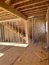 Framing, angle of staircase going up to the primary suite and third bedroom mini suite.