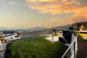 Exterior space with a mountain and lake views