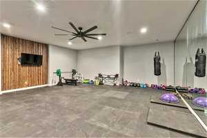Workout room featuring light tile flooring