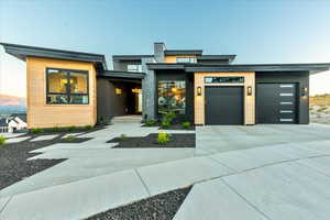 View of front of home featuring garage