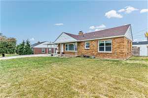 Single story home with a patio area. Automatic sprinkling system front and back lawn.