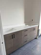 Bathroom featuring tile patterned floors and vanity