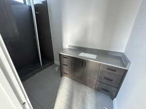 Bathroom featuring vanity and tile patterned floors