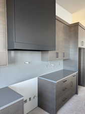 Kitchen featuring decorative backsplash