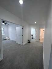 Hallway featuring carpet flooring