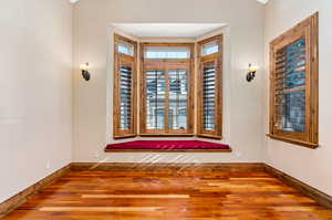 View of wood floored empty room