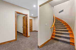 Stairs with light colored carpet