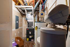 Utility room featuring gas water heater