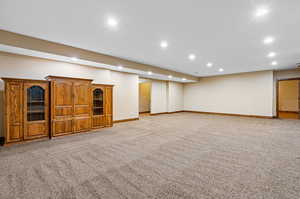 Basement with light carpet