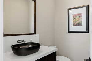 Bathroom featuring vanity and toilet