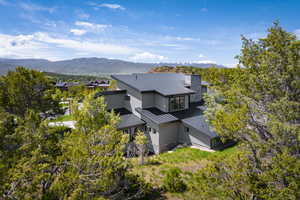 Birds eye view of property with a mountain view