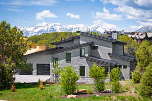 Contemporary house featuring a patio and a mountain view