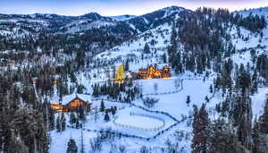 Snowy aerial view with a mountain view