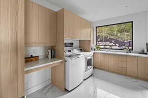 Laundry room with large utility sink, built-in iron board and access to a covered terrace.