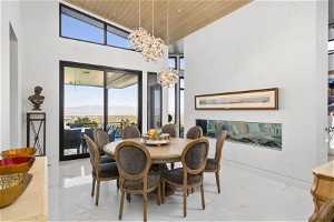 The formal dining room with glass sliding doors that lead to a covered view deck.