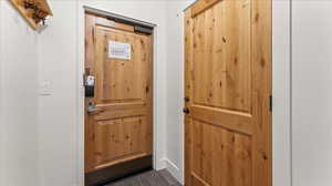 Entryway featuring dark hardwood floors