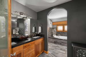 Bathroom with double vanity and a garden tub