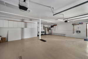 Garage with a garage door opener and electric panel