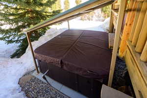 Exterior space with a hot tub