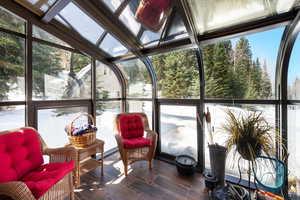 Sunroom / solarium with plenty of natural light and vaulted ceiling