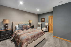 Carpeted bedroom featuring recessed lighting and baseboards