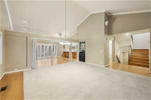 Light filled Living & Dining Rooms featuring Open Floor Plan w Grand Vaulted Ceilings