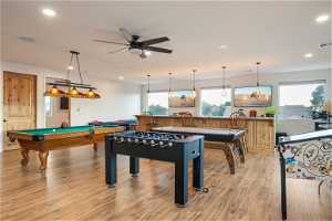 Game room featuring ceiling fan, pool table, and light hardwood floors