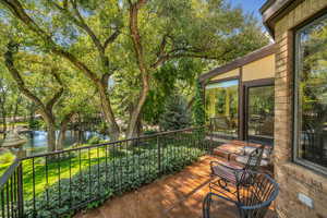 Wooden deck featuring a water view