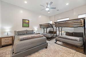 Bedroom with ceiling fan and light wood-type flooring