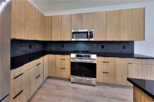 Kitchen features quartz countertops and high efficiency induction oven