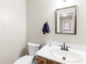 1/2 Bathroom with vanity and toilet