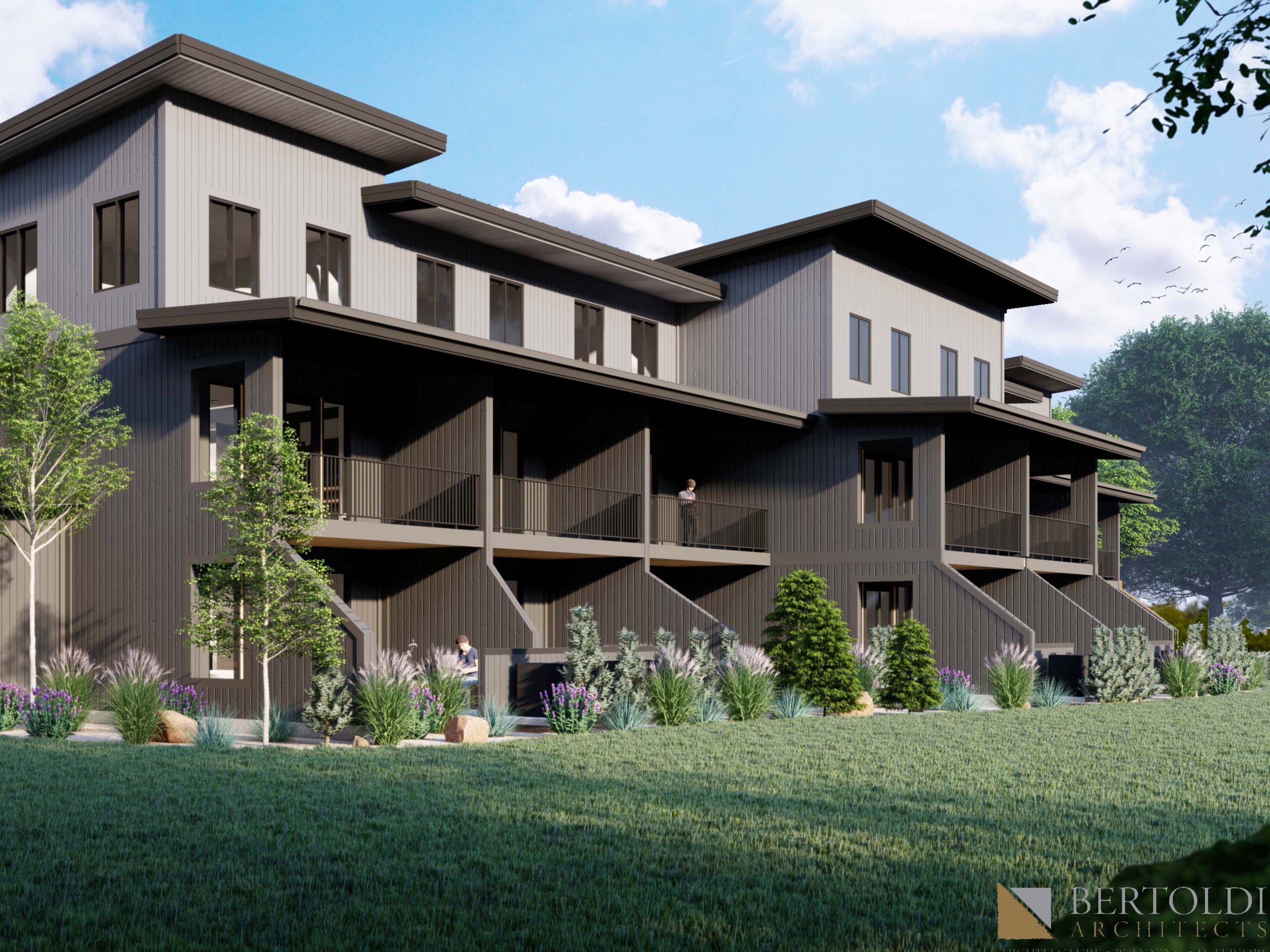Rear view of property featuring a balcony and a yard