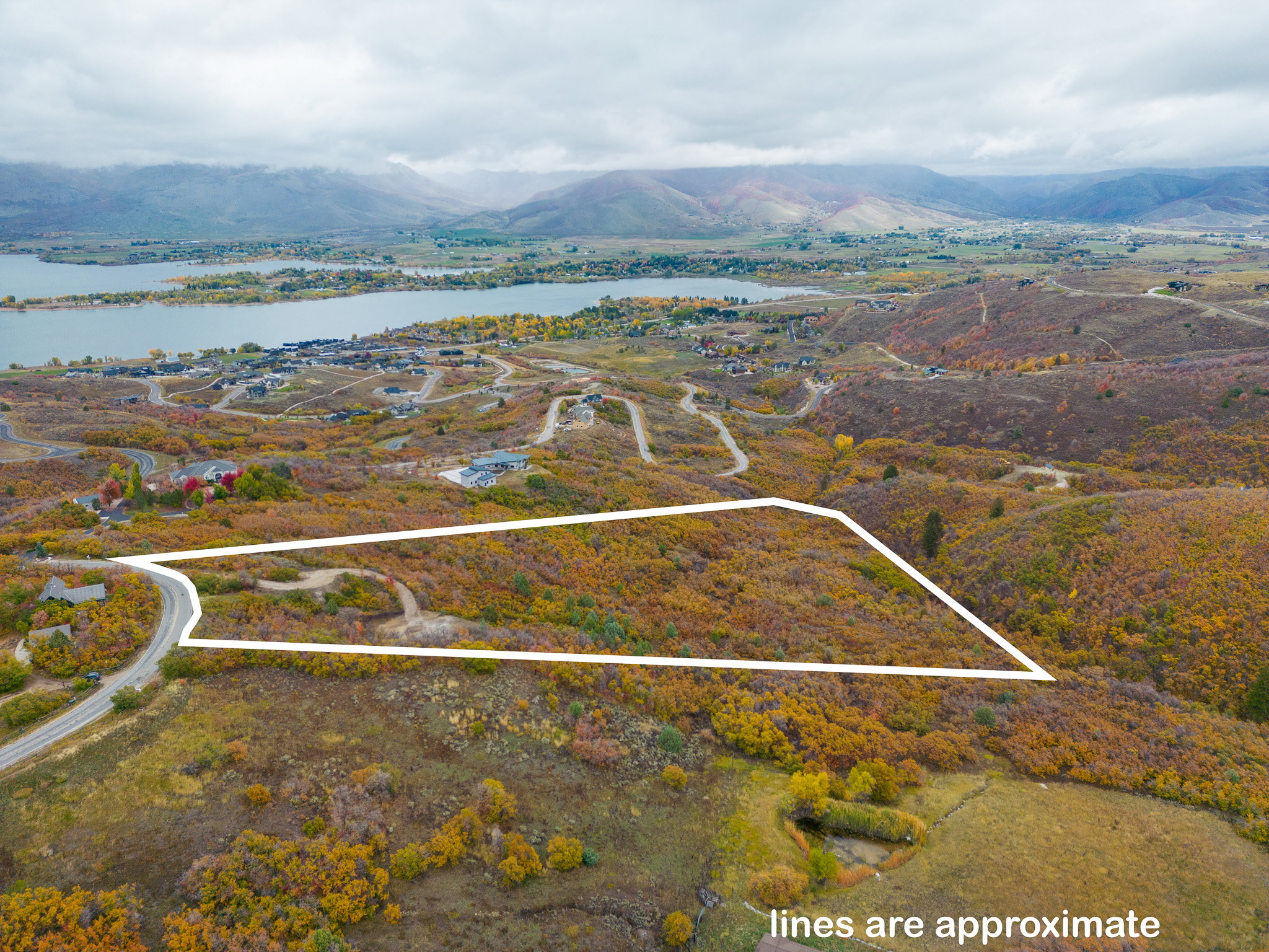Aerial view featuring a water and mountain view