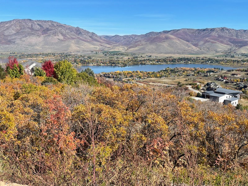 Property view of mountains with a water view