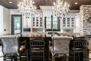 Kitchen featuring a chandelier and wood ceiling
