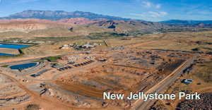 Birds eye view of property featuring a water and mountain view