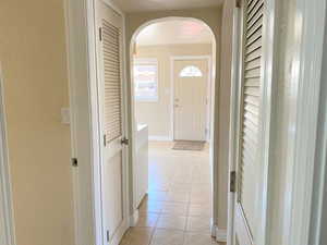 Corridor with light tile floors