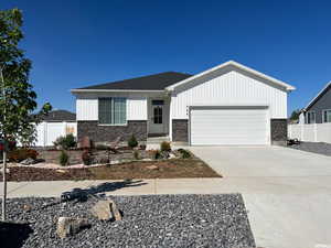 View of front facade featuring a garage